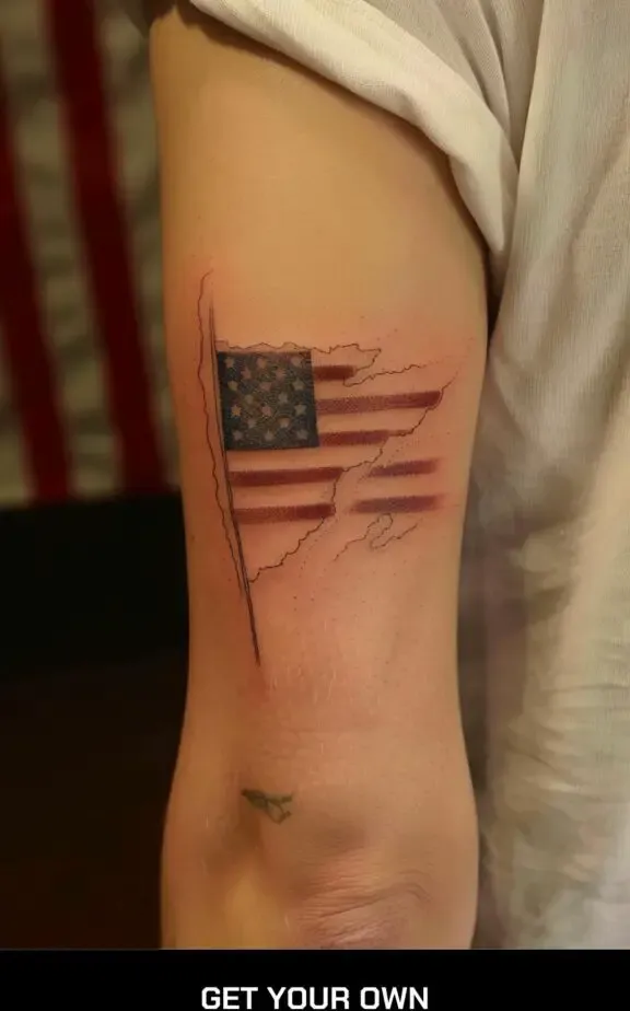 Torn American flag tattoo