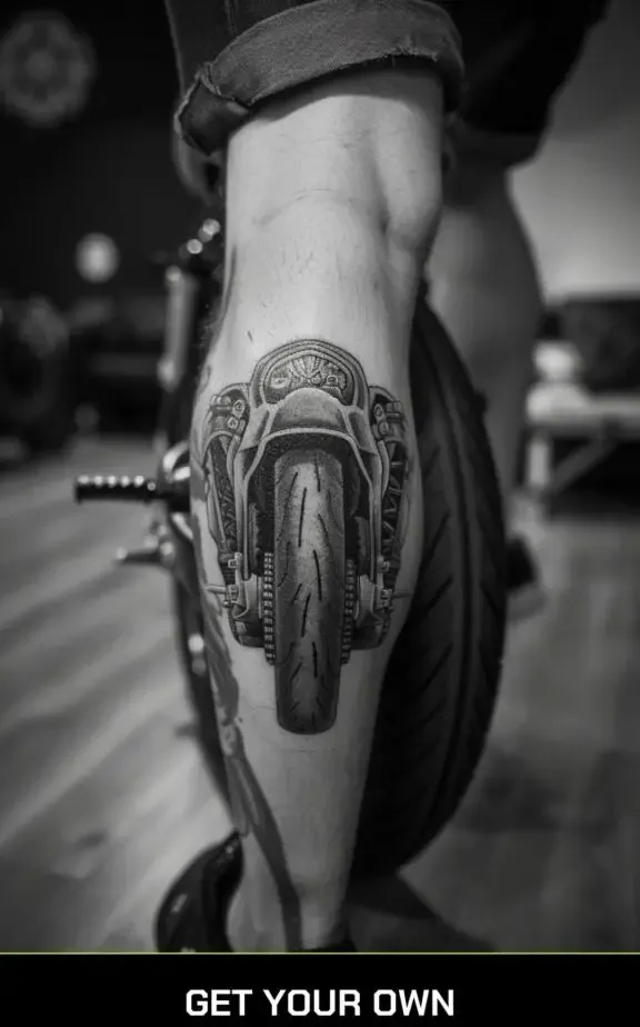 motorcycle wheel tattoo