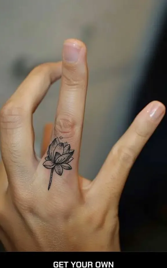 lotus flower finger tattoo