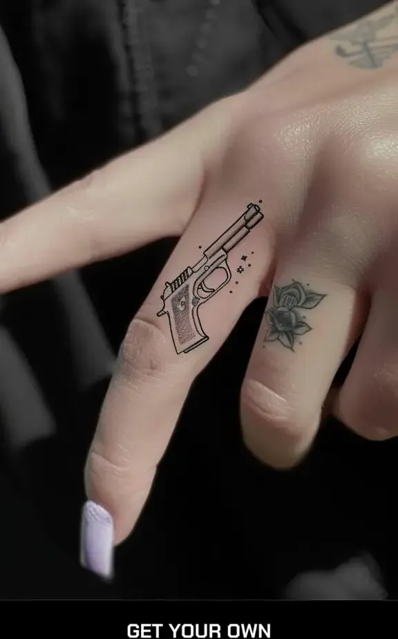 tiny gun finger tattoo