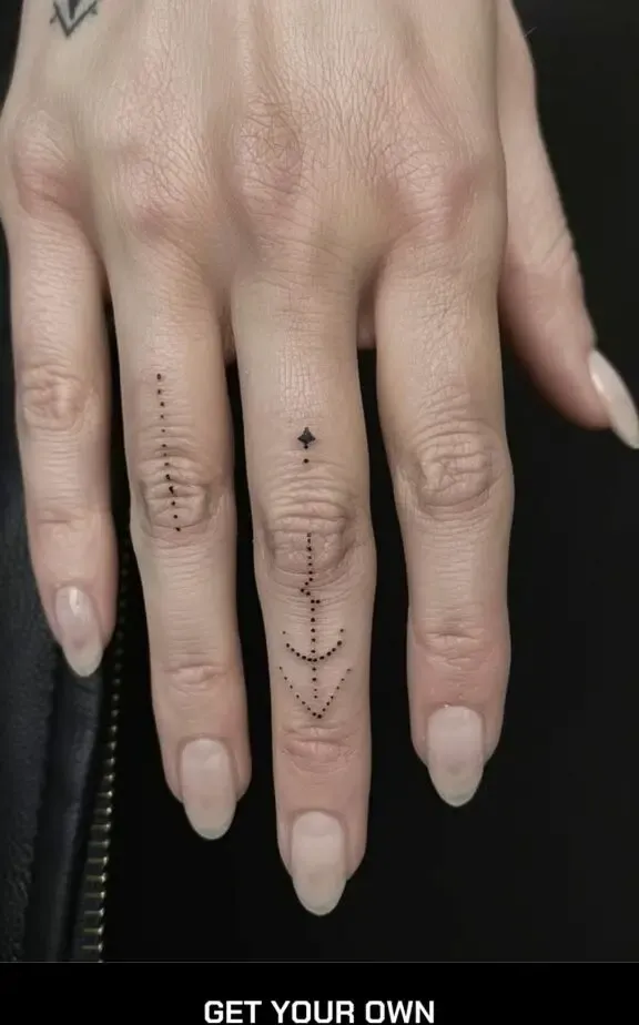 minimalist dots arrow tattoo