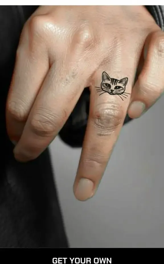 cute cat face tattoo on the finger