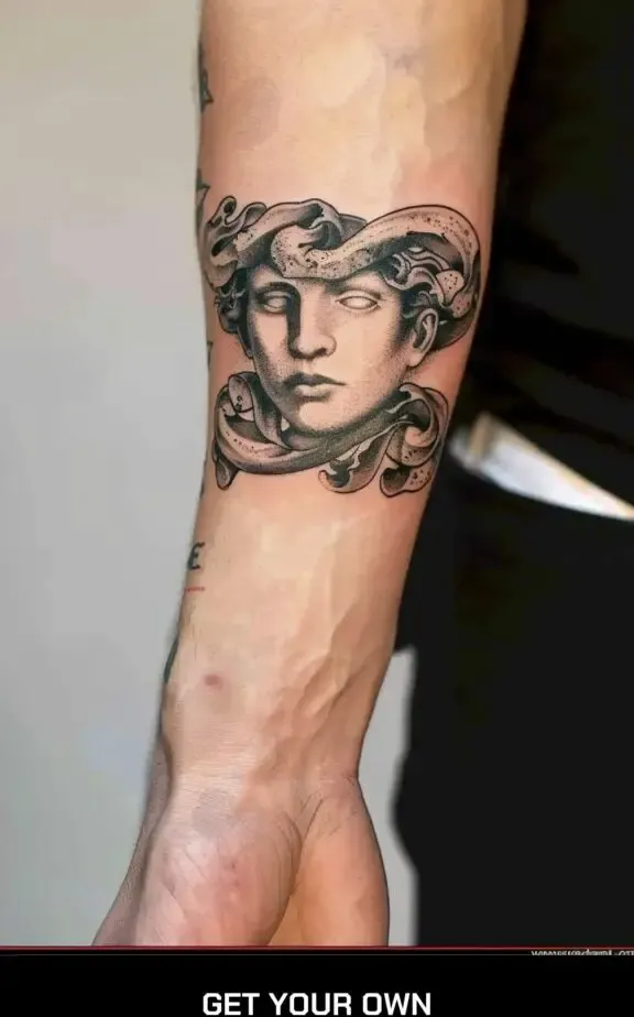 Forearm medusa tattoo