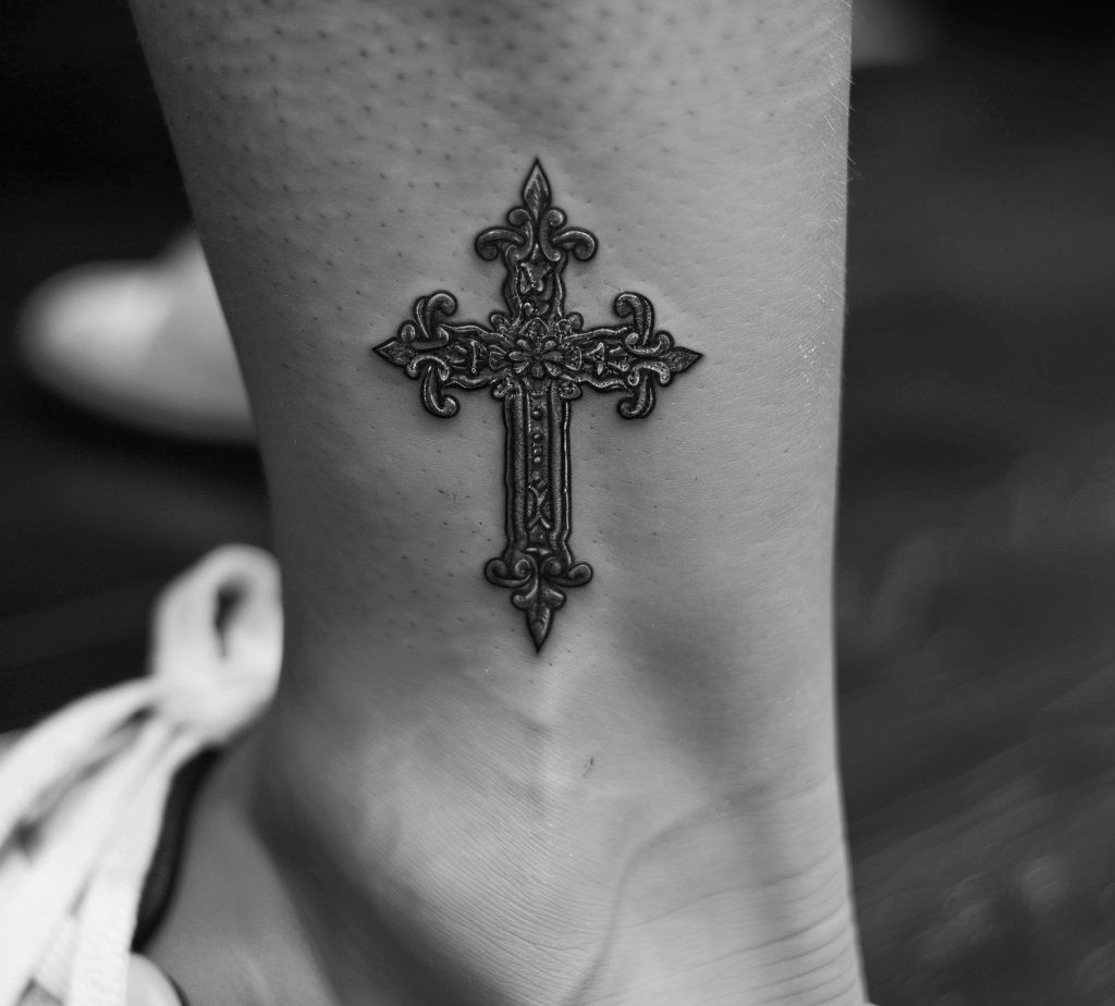 mandala cross on the ankle tattoo meaning