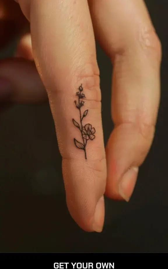 floral tattoo on the finger