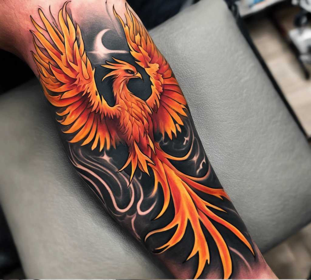 A red and black tattoo of a raising phoenix