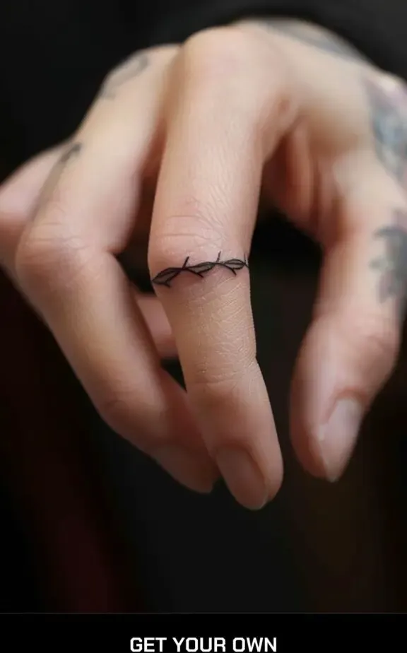 barbed wire finger tattoo