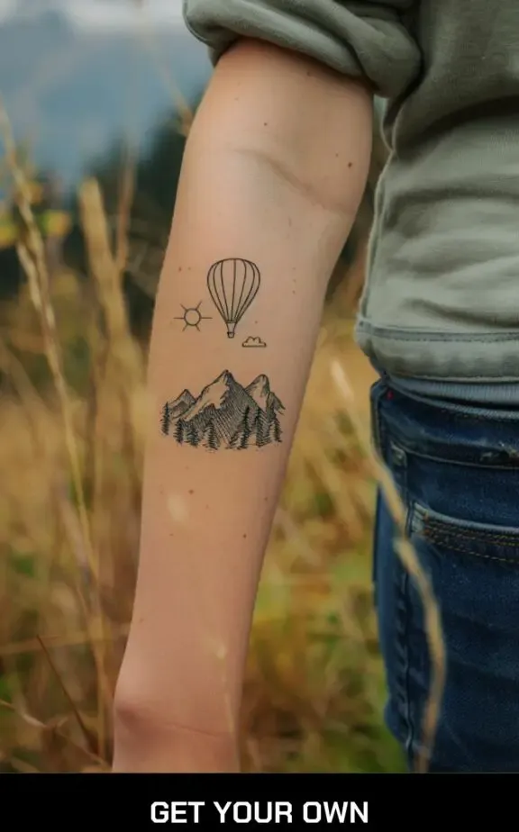 small beautiful tattoo: hot balloon and mountain