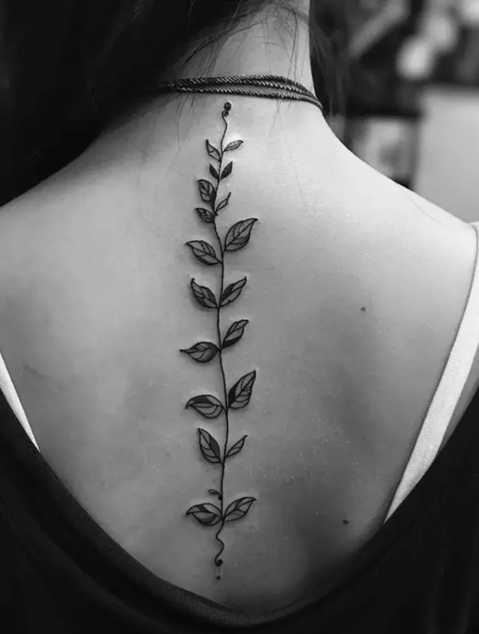 Women's vine spine tattoo
