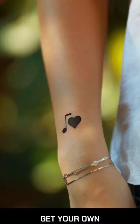 small beautiful tattoo: heart and music note tattoo