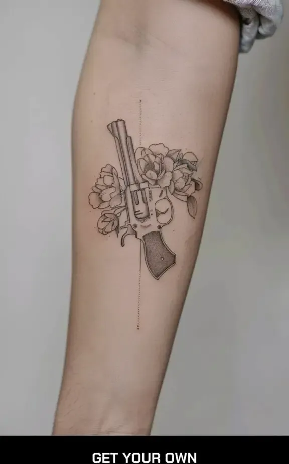 gun and flower tattoo