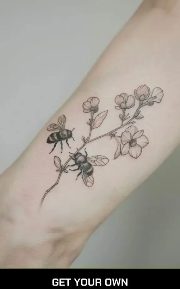 bee and botanical branch tattoo