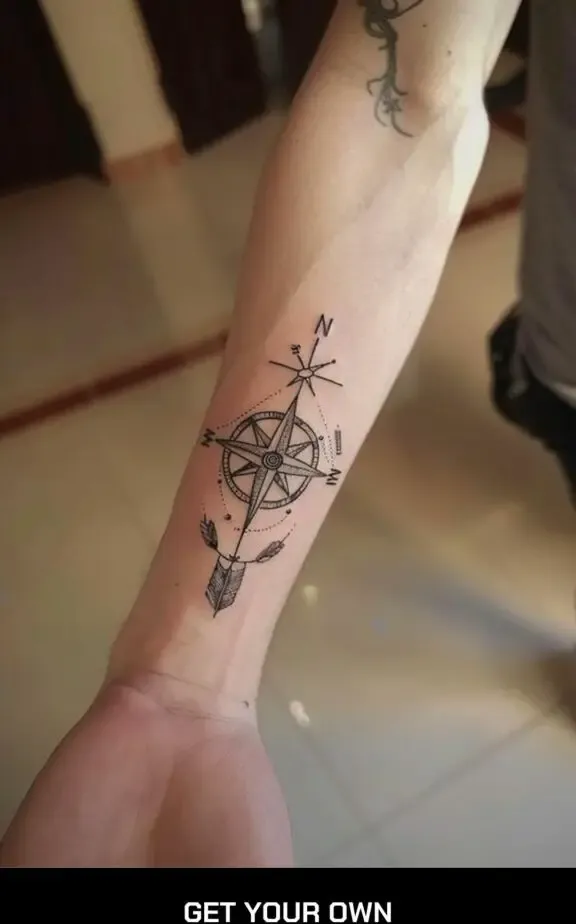 compass and arrow forearm tattoo