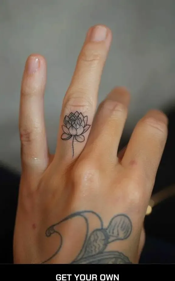 lotus flower finger tattoo