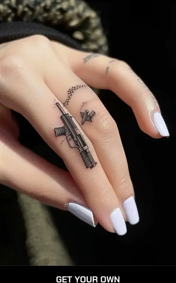 small gun finger tattoo