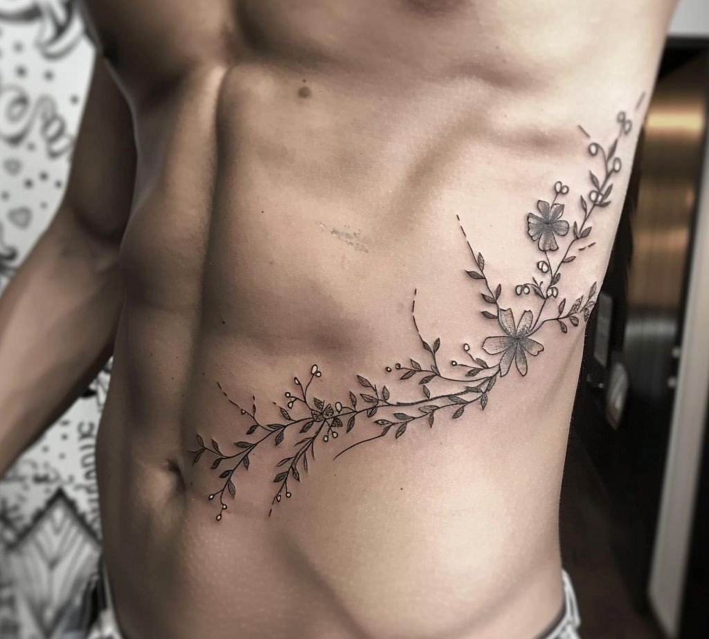 flower male side body tattoo