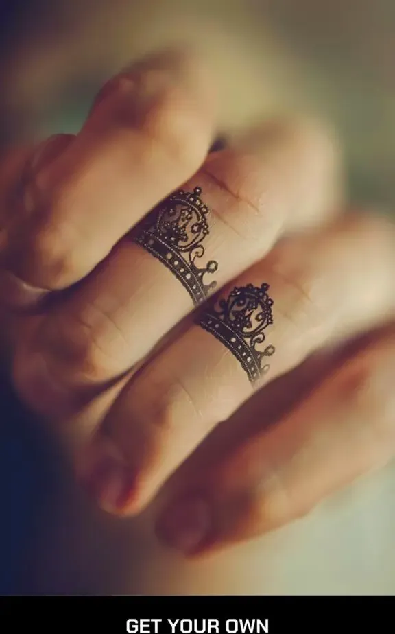 crown finger tattoo